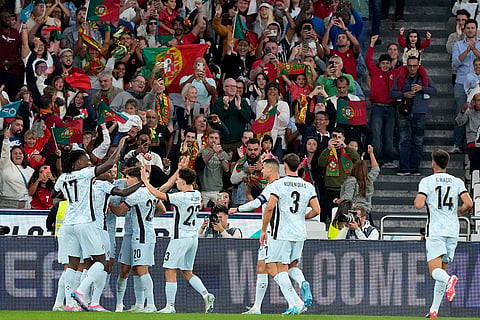 2024-25 Nations League Football Portugal vs Croatia: Portugal players celebrate after Diogo Dalot, obscured, scored the opening goal